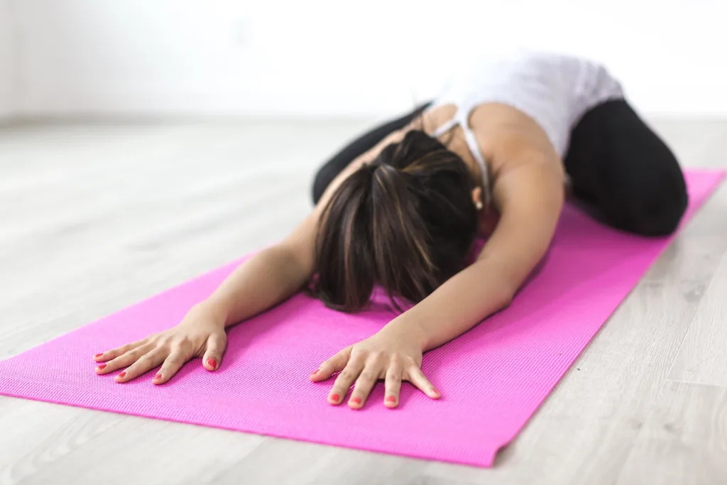 woman in child's pose yoga myth